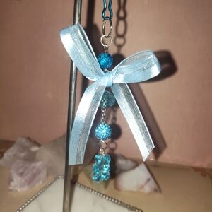 Elegant Blue Beaded Bow Pendant